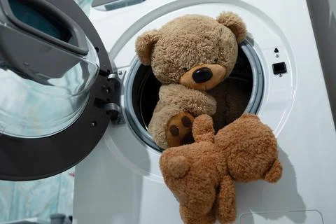 Adorable Teddy Bears Taking a Spin in the Washing Machine, Ready to Get Clean Stock Photos