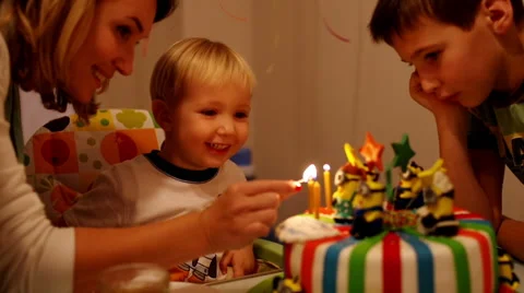 Adorable three year old boy celebrating his birthday Stock Footage 47806914