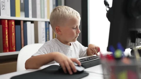 Adorable toddler student using computer ... | Stock Video | Pond5