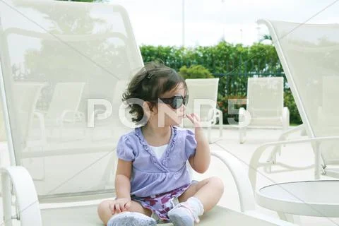 Adorable young baby girl wearing sunglasses in flirting position Stock Illustration