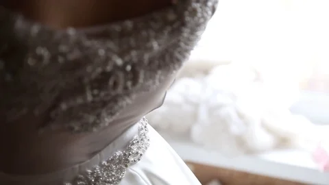 Adorable young bride is getting ready in the morning at home. The bride getting Stock-Footage 127951968