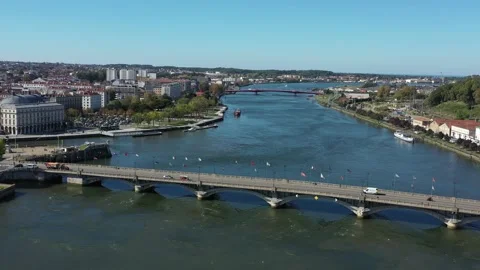 Adour River and Saint-Esprit bridge, Bayonne in France. Aerial drone Stock Footage 235350891