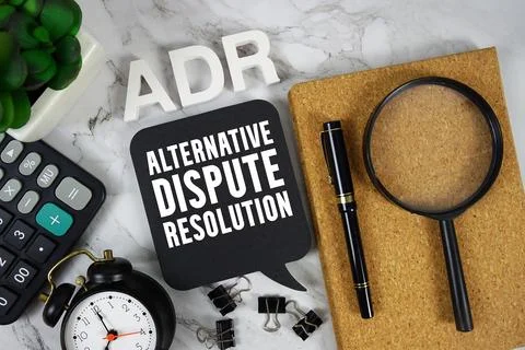 ADR Alternative Dispute Resolution text with Calculator, alarm clock and ma.. Foto stock