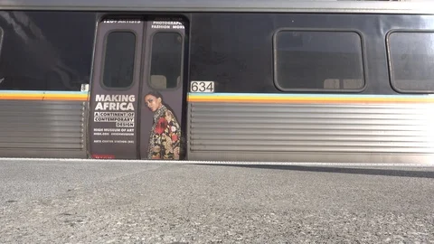 The ads on trains that will pick up passengers at the peachtree station Atlanta, Video stock 104939227