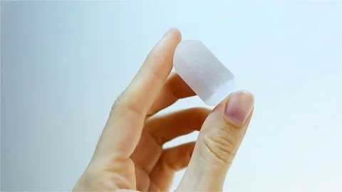 Adularia - Moonstone (Orthoclase or Belomorite). Jeweler holding Adularia Stock Footage