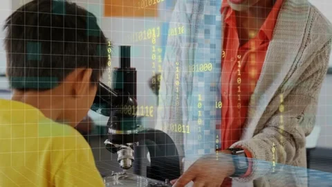 Adult adjusting microscope slide and guiding child to eyepiece while digital Stock Footage 334371747