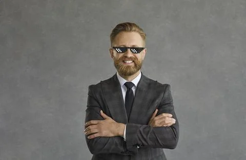 Adult businessman wearing formal suit, tie and funny thug life glasses Stock Photos