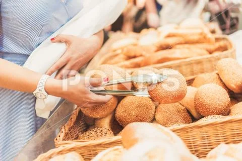 Adult consumer taking small bap Stock Photos