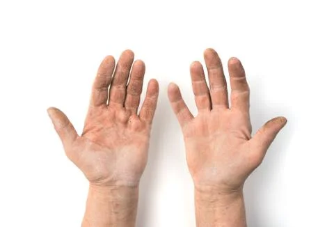 Adult hands smeared with work isolated on a white background. Stock Photos