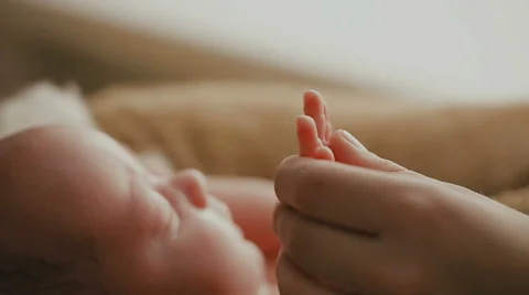Adult holding a baby hand 動画素材 59162214