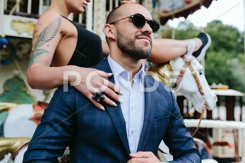 Adult man and woman on a carousel Stock Photos