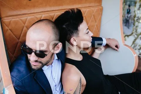 Adult man and woman on a carousel Stock Photos