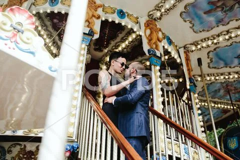 Adult man and woman on a carousel Stock Photos