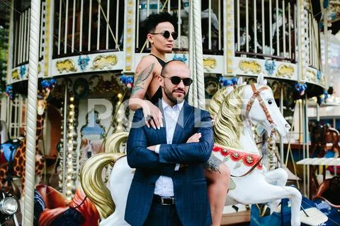 Adult man and woman on a carousel Stock Photos