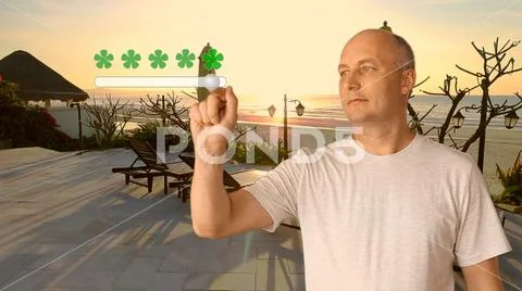 The adult man on a background of a swimming pool puts a rating of services. A Stock Photos