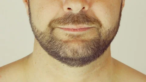 Adult man with a beard. He eats strawberries with yogurt. Видео 107501004