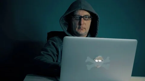 Adult man brows internet on computer. Man sits at table with laptop late night Stock Footage 82722816