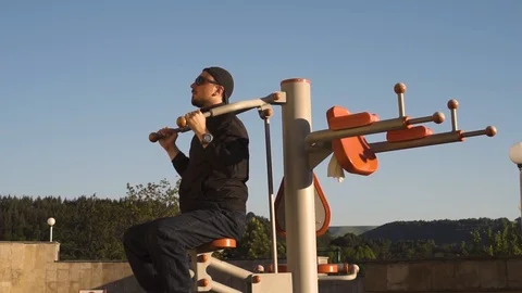 Adult man doing workout during the break from work 動画素材 108929685