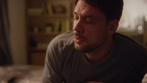 Adult Man Drinking Water while Struggling with Panic Thoughts in Bedroom Stock Footage 330600656