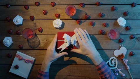 Adult man gets empty present box as valentine day gift, top view Stock Footage 87979096
