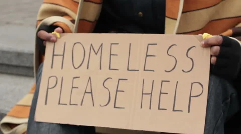 Adult man holding homeless please help sign, poverty, social vulnerability Stock Footage