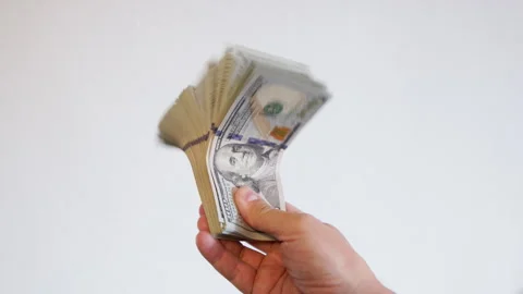 Adult man holding stack of paper currency indoors Stock Footage 332125841