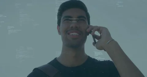 Adult man receiving call while holding phone to right ear, code overlay shifting Stock Footage 334036653