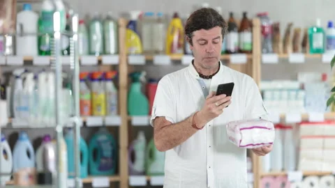 Adult man scanning qr code for unclogging gel Stock Footage 319492189