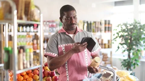 Adult man scanning qr code of beans Stock Footage 332636009