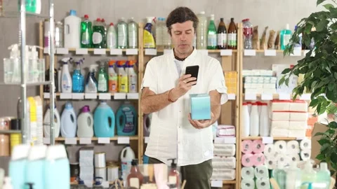 Adult man scanning qr code for unclogging gel Stock Footage 332734213