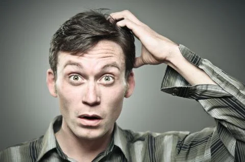 Adult Man Scratching His Head In Confusion Stock Photos