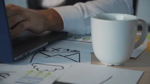 Adult man using personal computer and making new website page Stock Footage 119461742