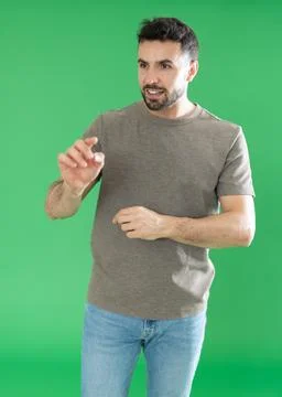 Adult man using virtual screen in front of green screen Stock Photos