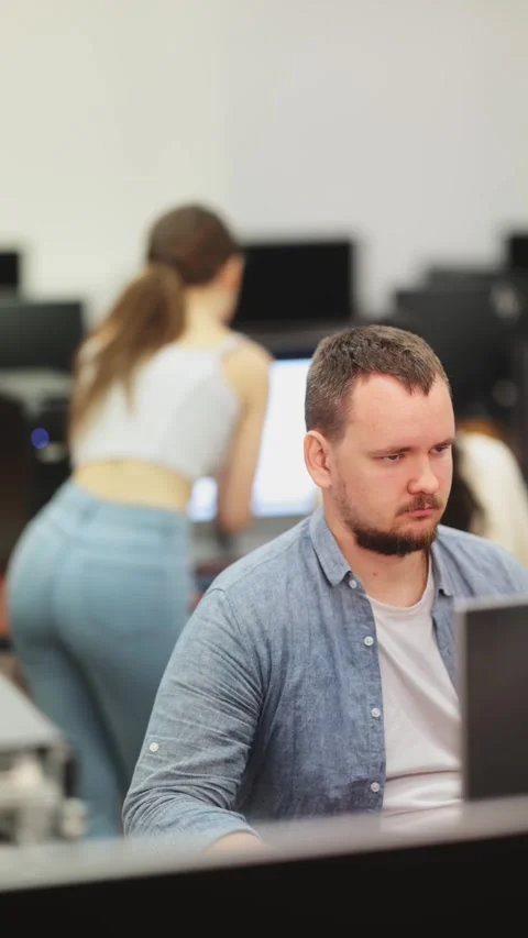 Adult man working on computer in office Stock Footage 335613149