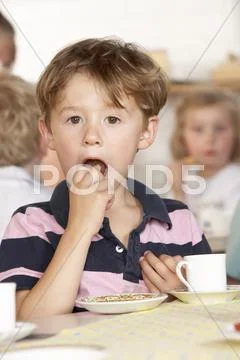 Adult Playing with Two Children at Montessori/Pre-School Stock Photos