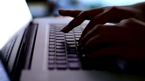 Adult programmer coding to develop a program at his office table during work Video stock 334586116