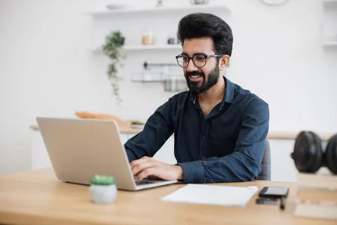 Adult typing on computer while working remotely from home Stock Photos