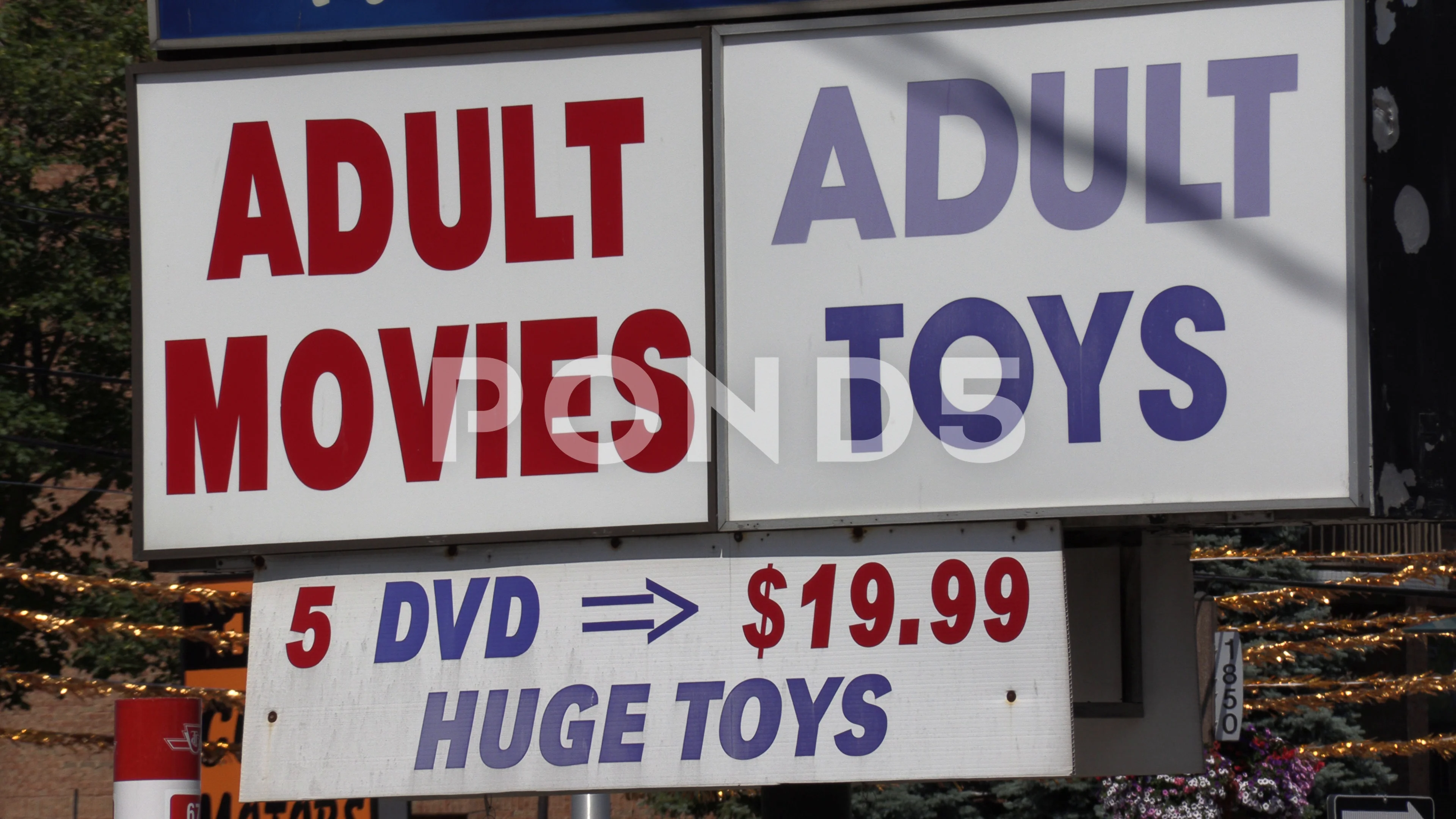 Adult video rental and toy store sign