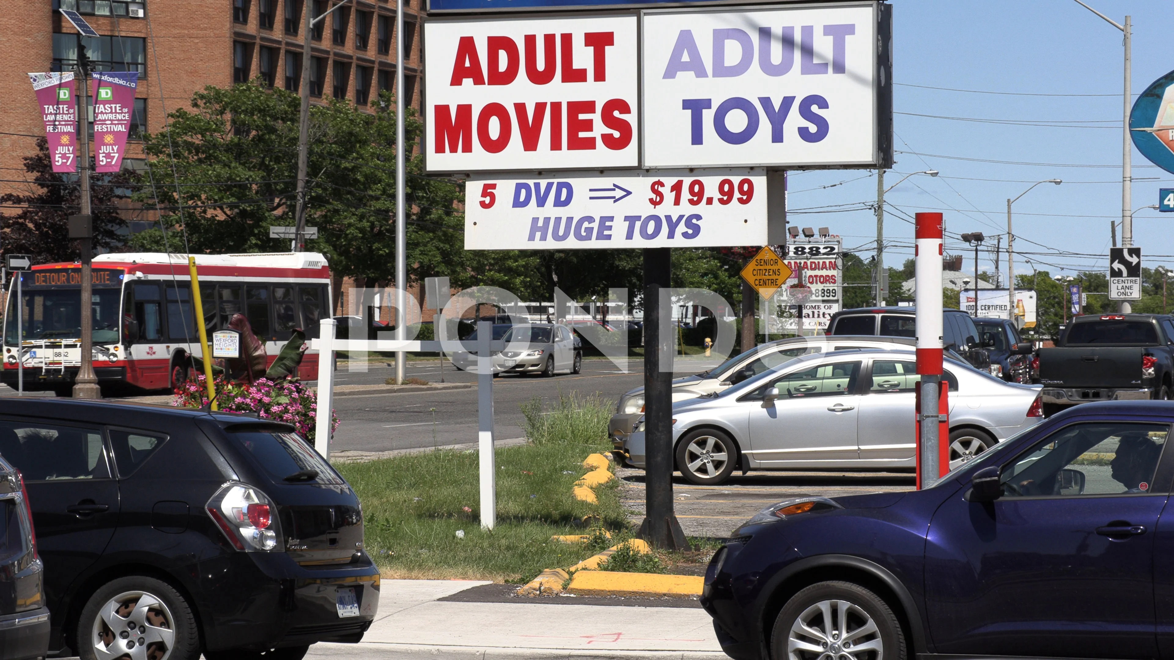 Adult video rental and toy store sign