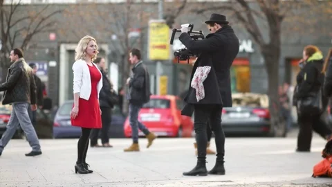 Adult Videomaker Setting up Scene Video stock 73027525