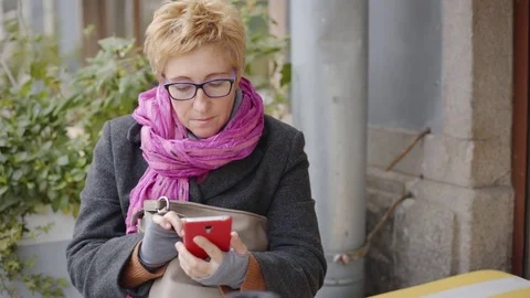 Adult woman with coffee and smartphone Stock Footage