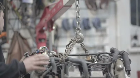 Adult worker inspecting car engine Stock Footage 68190827