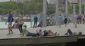 Adults and children relaxing on the seafront in Barcelona 4k or 4k+ Resolution