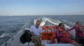 Adults and children sitting in a boat that sails in Panama Bay 4k or 4k+ Resolution