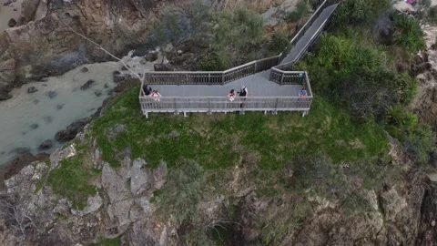 Adults On A Coastal Viewing Platform Looking Out To The Ocean - Byron Bay Stock Footage 239576332