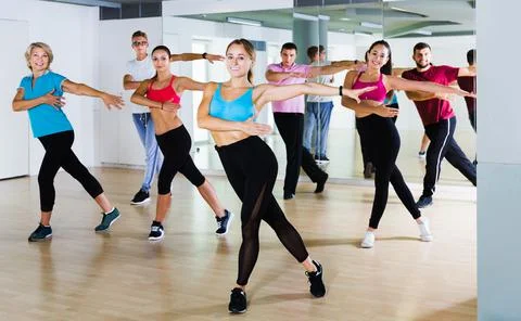 Adults of different ages dancing at dance class Foto stock