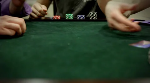 Adults playing poker card game Stock Footage