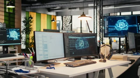 Advanced AI algorithms running on computer monitors in empty startup workspace Stockbeeldmateriaal 322703405