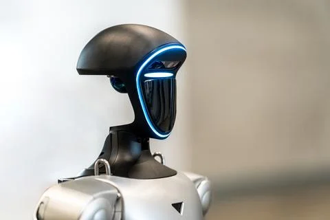 Advanced bipedal robot head with glowing blue lights Fotos Stock