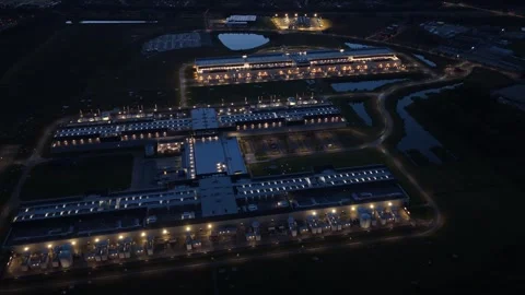 Advanced data servers glowing at night with cloud integration, AI-driven Stock Footage 318287709